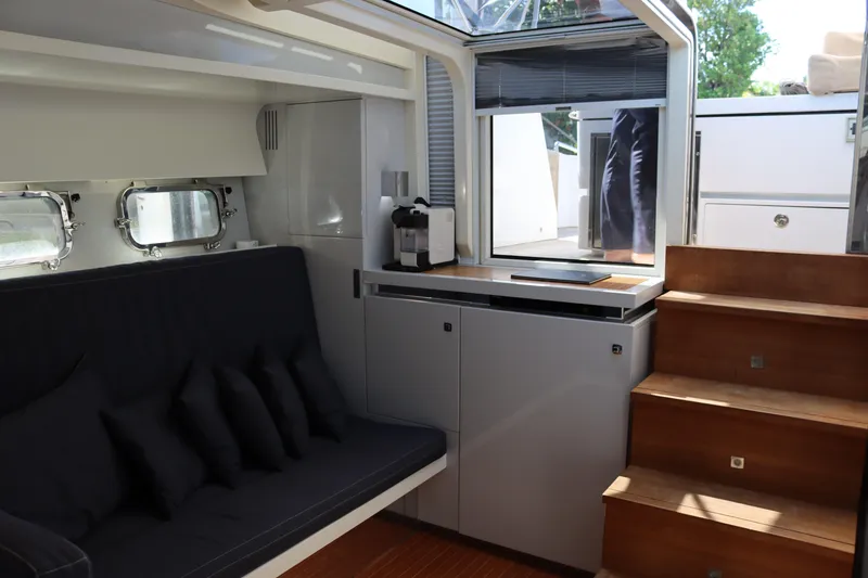 Slide: The Image of Luxurious CNM 50 yacht interior with modern seating and wooden stairs, 2010 model. - 19