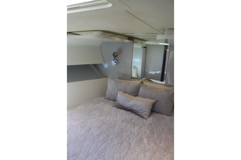 Slide: The Image of Cozy bedroom interior in a 2010 CNM 50 yacht with quilted bedding. - 20