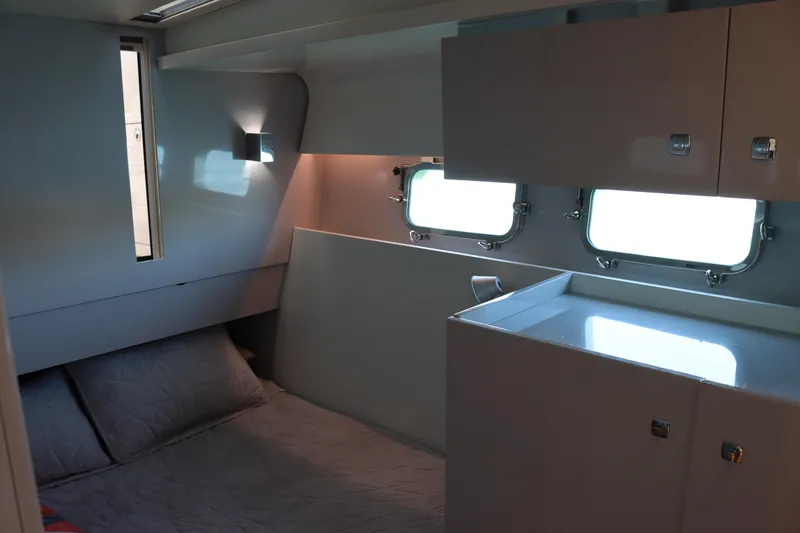 Slide: The Image of Modern yacht cabin interior with bed, storage, and windows, CNM 50, 2010 model. - 22