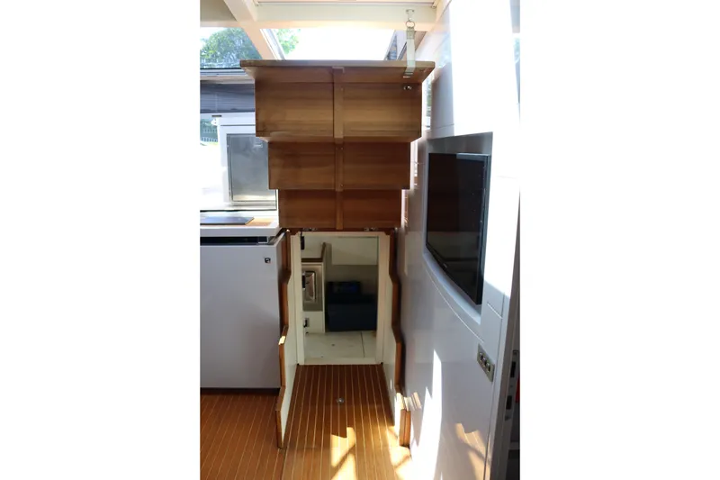 Slide: The Image of Interior of 2010 CNM 50 yacht with wooden cabinetry and modern appliances. - 23