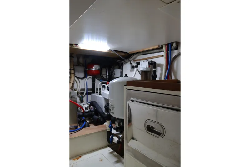 Slide: The Image of Engine room of a 2010 CNM 50 yacht with mechanical equipment and piping. - 24