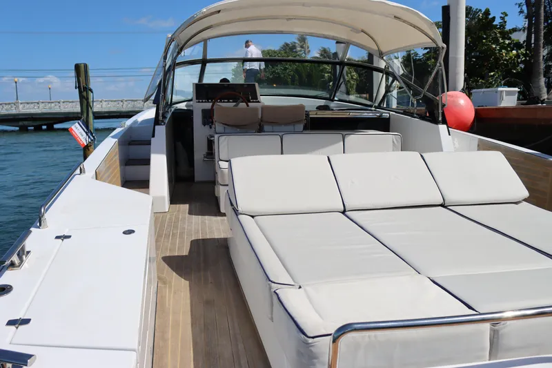 Slide: The Image of Luxurious 2010 CNM 50 yacht with spacious deck and comfortable seating on a sunny day. - 5
