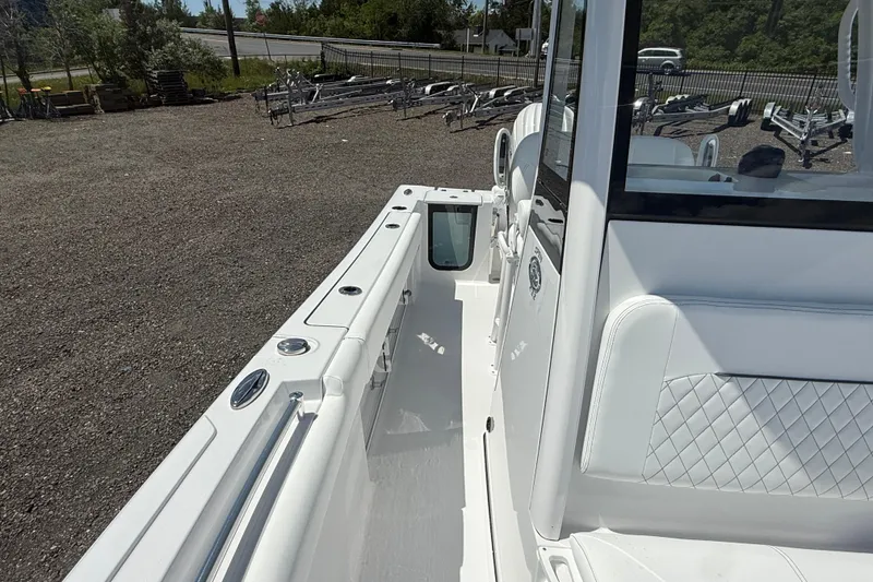 Slide: The Image of 2026 Sportsman Open 232 Center Console boat, featuring sleek white interior and modern design. - 5