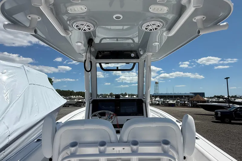 Slide: The Image of 2026 Sportsman Open 232 Center Console boat interior with modern helm and seating. - 8