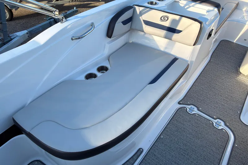 Slide: The Image of 2022 Hurricane SunDeck Sport 205 OB boat interior with cushioned seating and cup holders. - 10