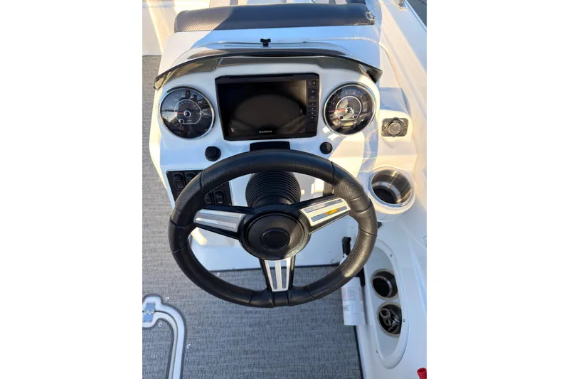 Slide: The Image of Steering console of 2022 Hurricane SunDeck Sport 205 OB with modern gauges and controls. - 13