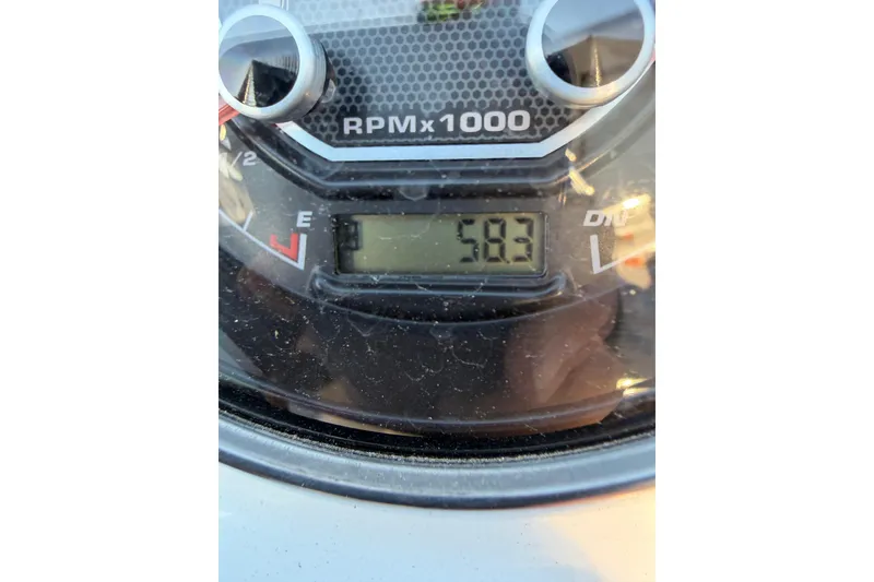 Slide: The Image of Close-up of 2022 Hurricane SunDeck Sport 205 OB tachometer displaying 583 RPM. - 14