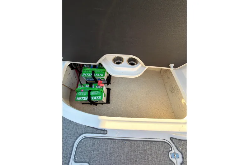 Slide: The Image of Batteries in storage compartment of 2022 Hurricane SunDeck Sport 205 OB boat. - 17