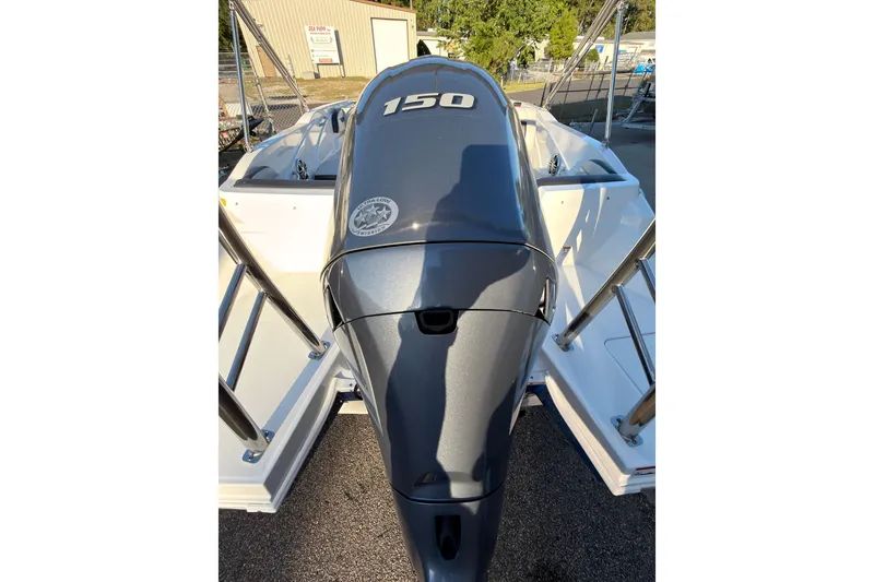 Slide: The Image of 2022 Hurricane SunDeck Sport 205 OB boat with a 150 horsepower outboard motor. - 4