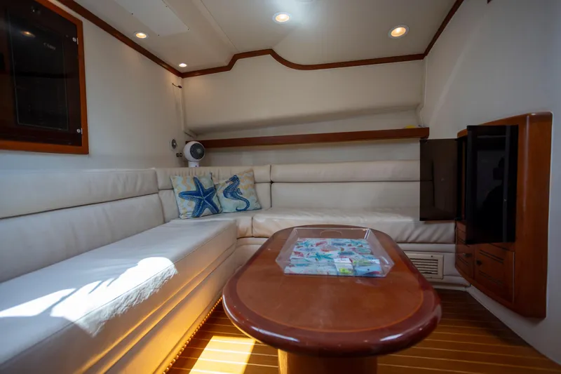 Slide: The Image of Luxurious interior of 2000 Cabo 45 Express yacht with plush seating and elegant wood finishes. - 2