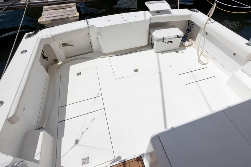 Slide: The Image of Spacious deck of 2000 Cabo 45 Express boat with storage compartments. - 9