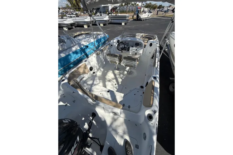 Slide: The Image of 2017 Hurricane SunDeck Sport CC 231 OB boat with spacious deck and seating. - 2