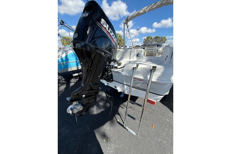 Slide: The Image of 2017 Hurricane SunDeck Sport CC 231 OB with Suzuki outboard motor and ladder. - 3