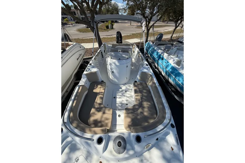 Slide: The Image of 2017 Hurricane SunDeck Sport CC 231 OB boat with spacious seating and sleek design. - 7