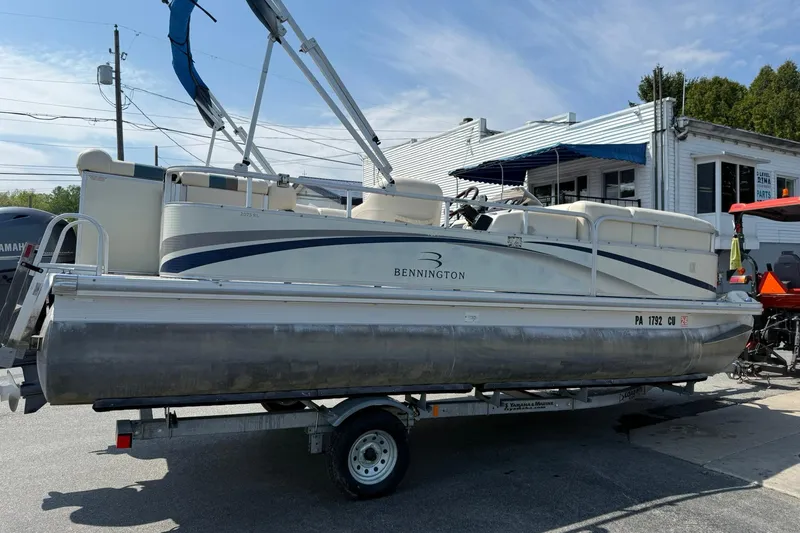 Slide: The Image of 2005 Bennington 2075RL pontoon boat on trailer, parked outdoors. - 5
