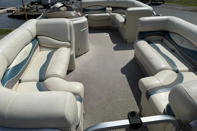 Slide: The Image of 2005 Bennington 2075RL pontoon boat with spacious seating and elegant interior design. - 6
