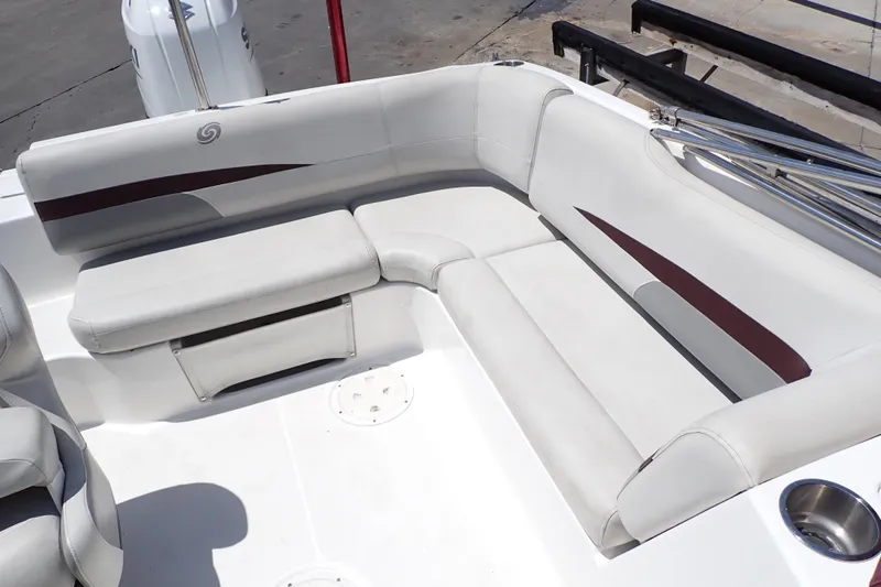 Slide: The Image of 2021 Hurricane SunDeck Sport 185 OB boat interior with white cushioned seating. - 11