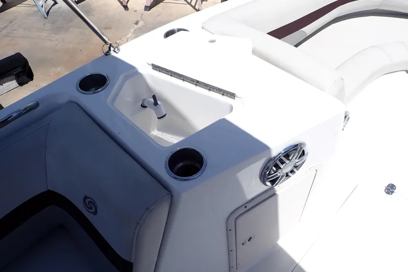 Slide: The Image of 2021 Hurricane SunDeck Sport 185 OB boat interior with sink and cup holders. - 17