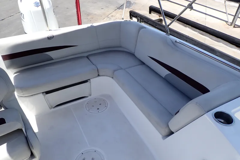 Slide: The Image of 2021 Hurricane SunDeck Sport 185 OB boat interior with cushioned seating and cup holder. - 19