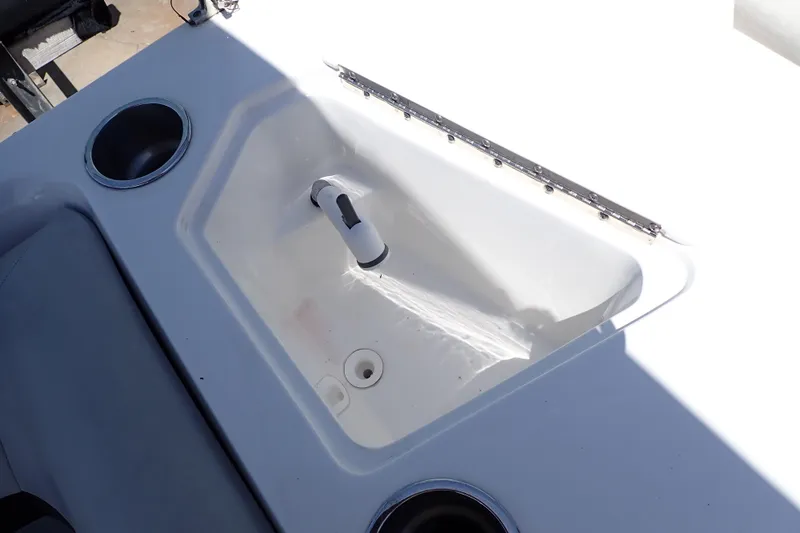 Slide: The Image of 2021 Hurricane SunDeck Sport 185 OB boat sink and cup holders in white interior. - 20