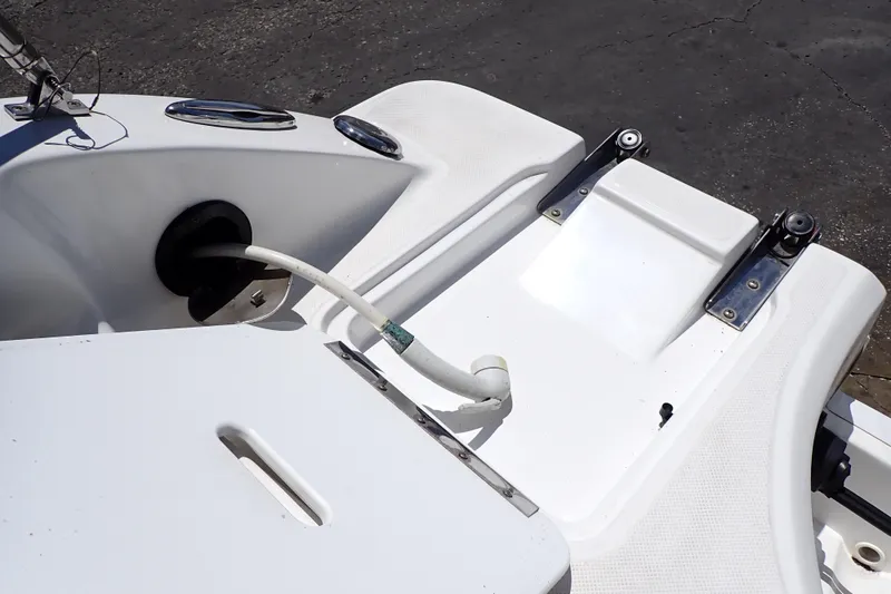Slide: The Image of 2021 Hurricane SunDeck Sport 185 OB boat deck with hose and fittings. - 23