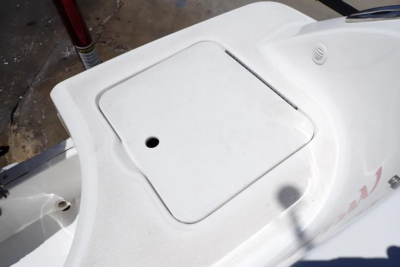 Slide: The Image of 2021 Hurricane SunDeck Sport 185 OB boat deck with storage compartment. - 25