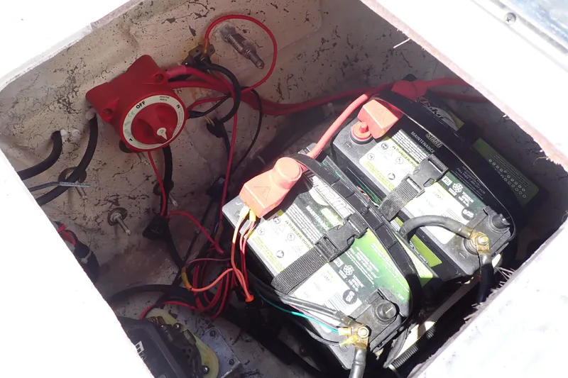 Slide: The Image of Battery compartment of 2021 Hurricane SunDeck Sport 185 OB boat with wiring and switch. - 26