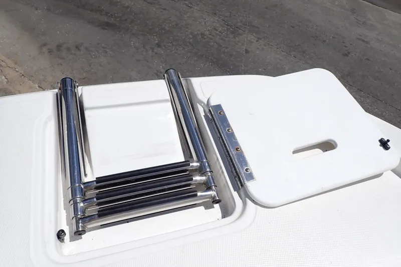 Slide: The Image of 2021 Hurricane SunDeck Sport 185 OB boat ladder and hatch on deck. - 32