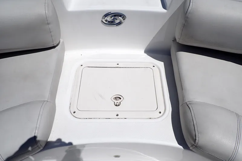 Slide: The Image of 2021 Hurricane SunDeck Sport 185 OB boat seating area with storage compartment. - 33