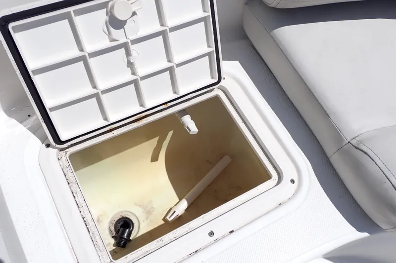 Slide: The Image of Open storage compartment on 2021 Hurricane SunDeck Sport 185 OB boat. - 34
