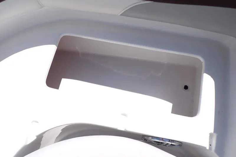 Slide: The Image of 2021 Hurricane SunDeck Sport 185 OB storage compartment, white interior, open hatch. - 36