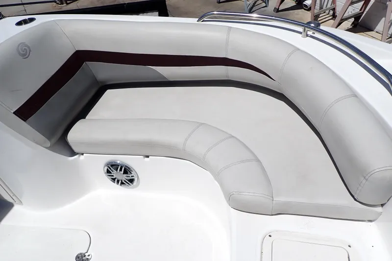 Slide: The Image of 2021 Hurricane SunDeck Sport 185 OB boat interior with cushioned seating and speaker. - 37
