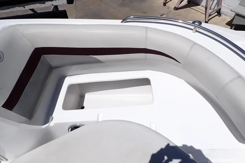 Slide: The Image of Interior seating of 2021 Hurricane SunDeck Sport 185 OB boat, featuring white and maroon upholstery. - 38