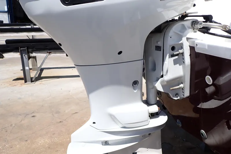Slide: The Image of 2021 Hurricane SunDeck Sport 185 OB outboard motor close-up in sunlight. - 51