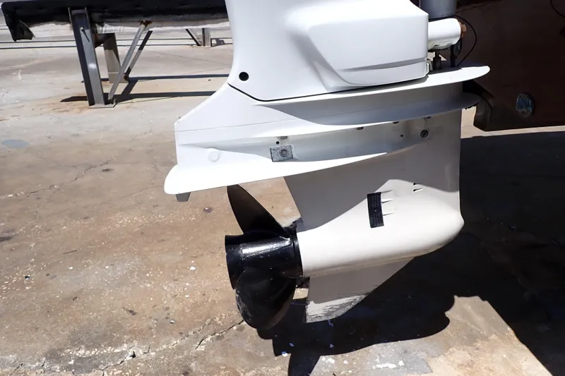 Slide: The Image of 2021 Hurricane SunDeck Sport 185 OB outboard motor close-up on concrete surface. - 52