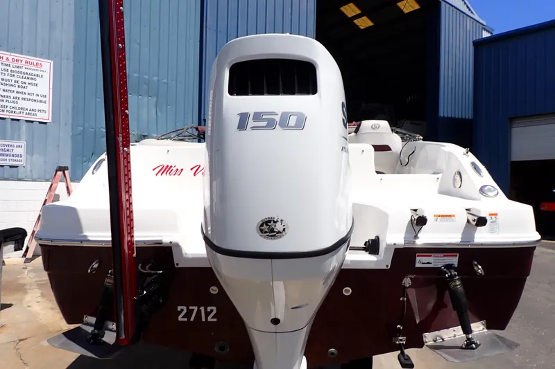 Slide: The Image of 2021 Hurricane SunDeck Sport 185 OB boat with 150 HP engine at a marina. - 53
