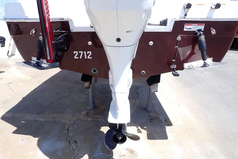 Slide: The Image of 2021 Hurricane SunDeck Sport 185 OB boat stern with outboard motor and hull details. - 54
