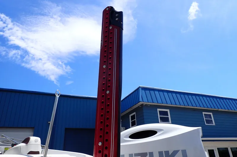 Slide: The Image of 2021 Hurricane SunDeck Sport 185 OB boat with Suzuki engine, blue sky background. - 58