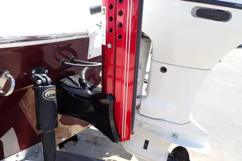 Slide: The Image of 2021 Hurricane SunDeck Sport 185 OB boat engine and trim system close-up. - 60