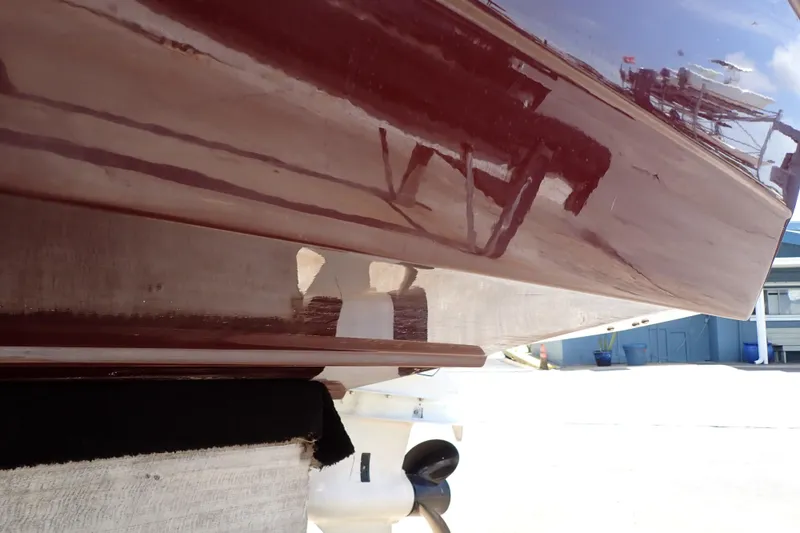 Slide: The Image of 2021 Hurricane SunDeck Sport 185 OB boat hull, glossy finish, docked outdoors. - 70