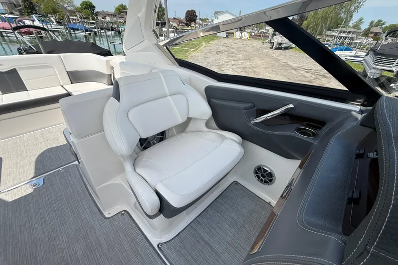 Slide: The Image of Interior of 2016 Chaparral 307 SSX boat with white seating and modern design. - 14