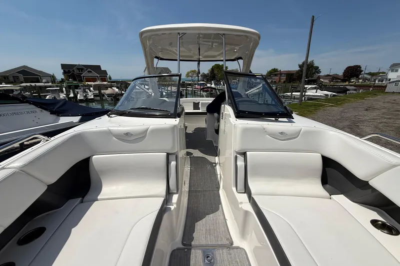 Slide: The Image of 2016 Chaparral 307 SSX boat interior with white seating and open cockpit. - 20
