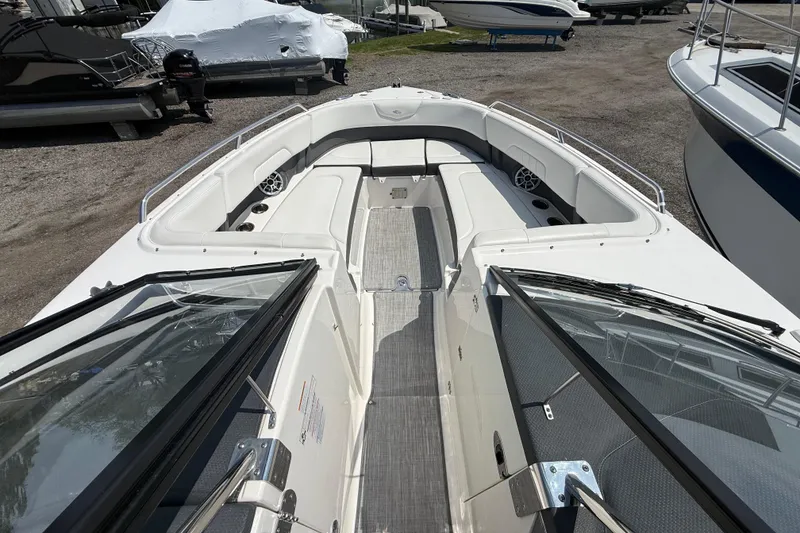 Slide: The Image of 2016 Chaparral 307 SSX boat interior with spacious seating and sleek design. - 21