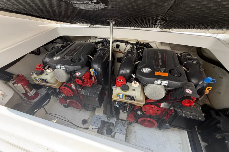 Slide: The Image of Engine compartment of 2016 Chaparral 307 SSX boat with dual engines and fire extinguisher. - 24