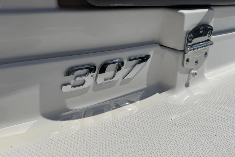 Slide: The Image of Chrome "307" emblem on a 2016 Chaparral 307 SSX boat. - 7
