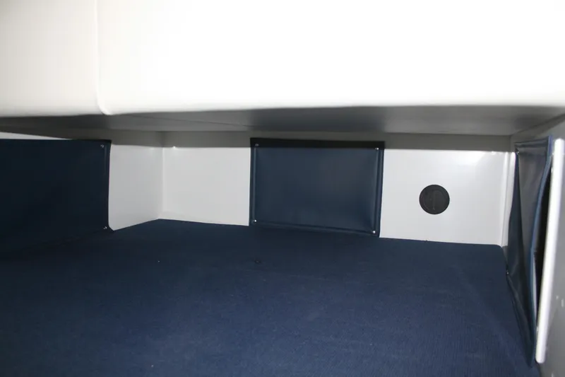 Slide: The Image of Interior cabin of 2014 Ocean Sport 27' Legacy boat, featuring blue and white design. - 14