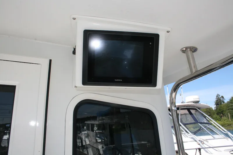Slide: The Image of Garmin display on 2014 Ocean Sport 27' Legacy boat, exterior view. - 19