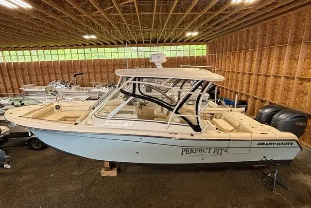 The Image of 2022 Grady-White Freedom 285 boat in storage, featuring sleek design and spacious interior. - 0