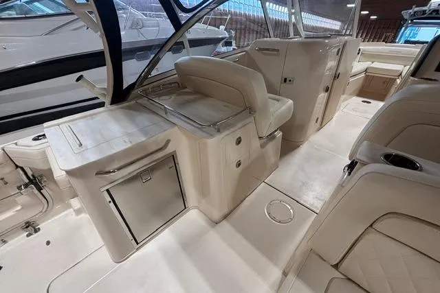 Slide: The Image of 2022 Grady-White Freedom 285 boat interior with seating and storage compartments. - 12