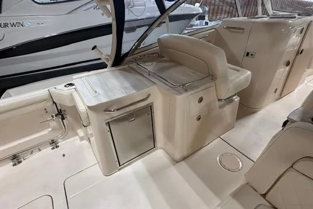Slide: The Image of 2022 Grady-White Freedom 285 boat interior with seating and storage compartments. - 13